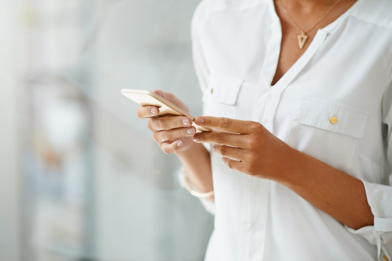 Woman hands holding mobile phone